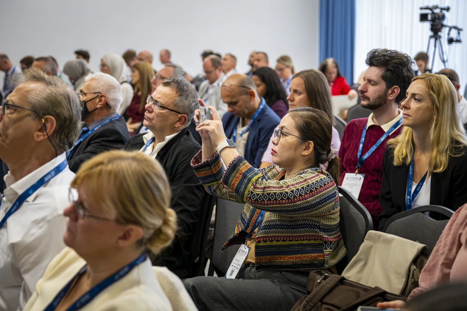 Conference participants listening to a presentation